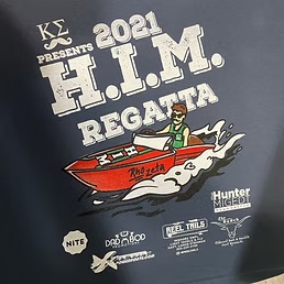 2021 H.I.M. Regatta event shirt screen printed on navy with a speedboat illustration and sponsor logos, including Dad Bod Screen Printing